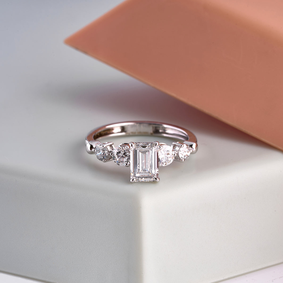 Emerald Cut Diamond Solitaire With Accent Ring.