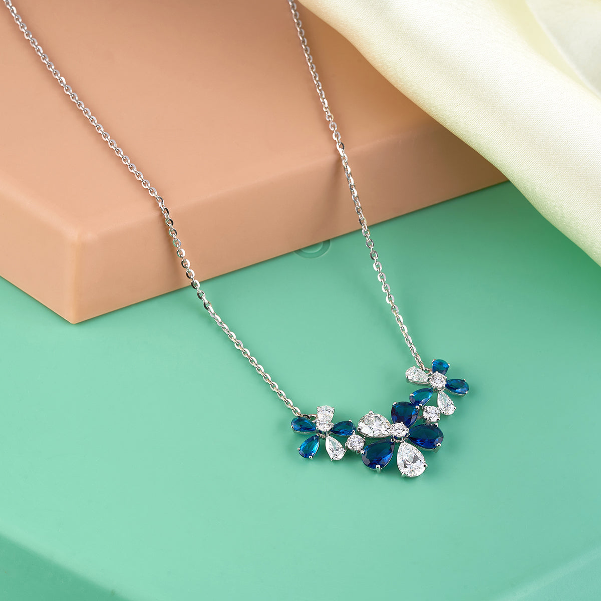 Blue Pear & Round Cut Diamond Floral Necklace.