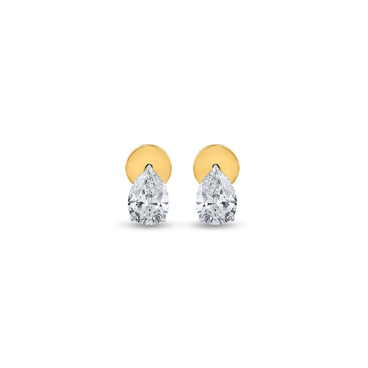 "Pear shaped diamond earrings with polished gold details. Discover more luxurious designs