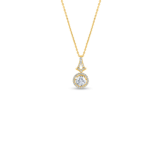 "Elegant round diamond halo pendant in 18k yellow gold. Discover a wide selection of beautiful diamond jewelry on ."