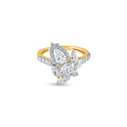 "Pear Cut Diamond Cluster Setting with Accent Ring"
